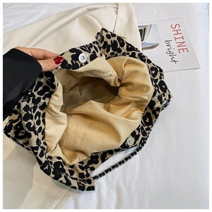 Retro leopard print crossbody bag with metal chain strap shown from a 45-degree angle