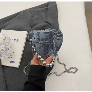 Blue denim heart shaped bag with silver bead handle and chain shoulder strap