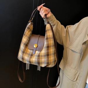 Chic vintage plaid shoulder bag with brown leather flap and gold metal buckle