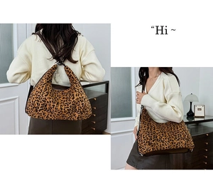 Detail view of large leopard print hobo bag showing stylish canvas texture and drape