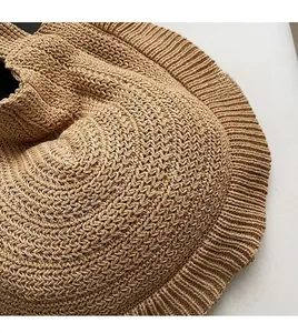 Macro shot of khaki crocheted shoulder bag showing detailed woven texture and soft fabric
