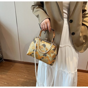 Yellow vintage embroidery crane bag with bamboo handle and pearl shoulder chain