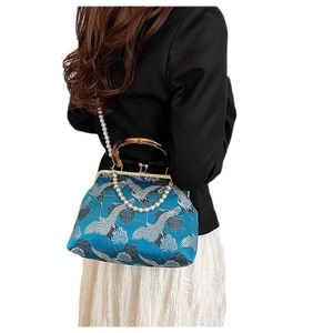 Blue satin shoulder bag with crane embroidery, bamboo handle and pearl straps