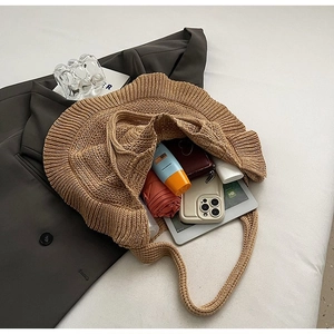Detail of khaki crochet shoulder bag showing spacious interior for daily essentials
