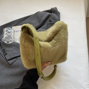 Detail of olive green faux fur shoulder bag with adjustable smooth leather strap