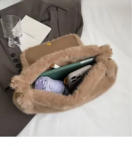 Spacious interior of brown plush tote bag showing daily items like umbrella and phone