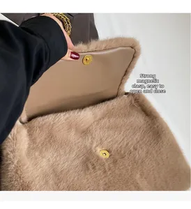 Close-up of light brown plush bag featuring strong magnetic snap closure and metal chain