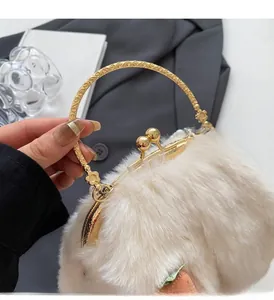 Detailed close-up of plush faux fur handbag featuring ornate gold metal handles and strawberry