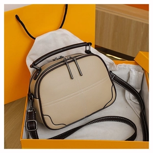 Boston bag set in orange gift box with dust bag, featuring stitch details and strap
