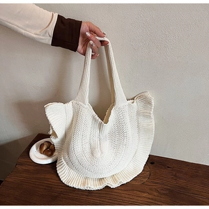 Chic beige knit tote bag with pleated ruffle edges and vertical striped texture