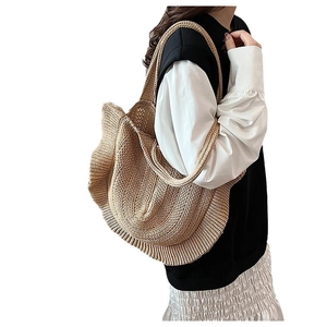Chic straw shoulder bag with ruffled edges in light brown, bohemian style for women