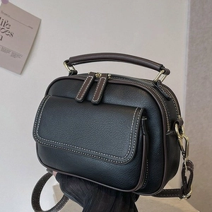 Vintage-Handtasche aus schwarzem Leder mit braunem Besatz und Doppelreißverschluss