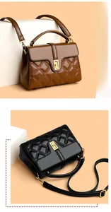 Detail view of quilted leather handbags in black and brown with golden metal buckles