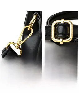 Detailed view of premium gold-plated hardware and black litchi texture leather handbag