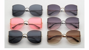 Array of oversized retro sunglasses in various gradient colors with metal temples