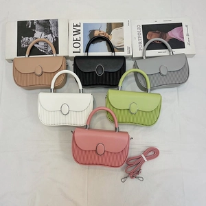 Detailed collection of textured crossbody bags in six colors with metallic oval buckle