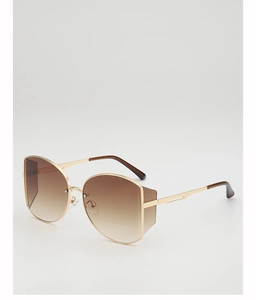 Detail view of large gold metal frame sunglasses with gradient lenses and side shield
