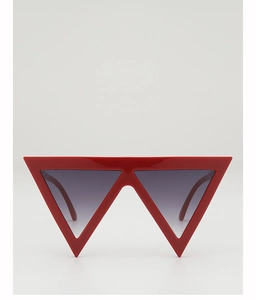 Front view of bold red triangular sunglasses with futuristic oversized frames and gradient lenses