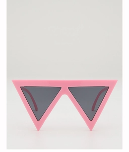 Close-up of trendy pink triangle sunglasses with dark grey lenses for party fashion
