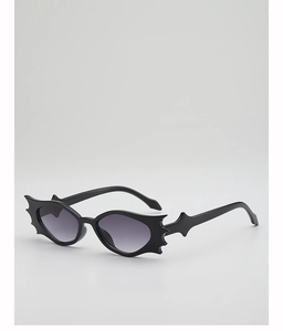 Side view of black bat-wing shaped sunglasses with unique spiked gothic frames
