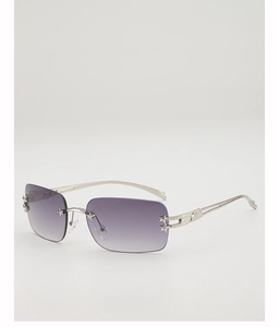 Detail of Y2K rimless sunglasses with purple gradient lenses and silver star accents