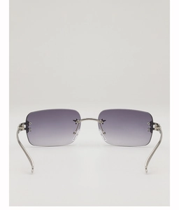 Detail of Y2K rimless square sunglasses featuring purple gradient lenses and star accents
