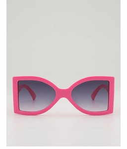 Detailed front view of bright pink oversized butterfly sunglasses with gradient lenses