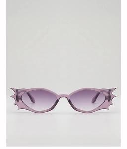 Macro detail of purple translucent bat-wing frame and gradient lenses on novelty sunglasses