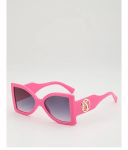 Detail of pink oversized sunglasses with gradient lenses and gold logo on temple