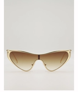 Détail de lunettes de soleil œil-de-chat de luxe avec monture dorée et verres dégradés