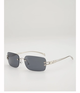 Macro shot of silver star metal accents on the temple of rimless Y2K square sunglasses