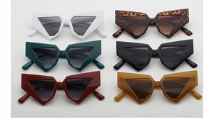 Collection of six geometric chunky sunglasses in various bold colors with a flat layout