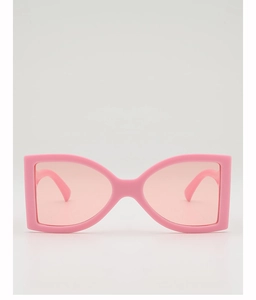 Detailed view of pink bow-shaped fashion sunglasses with matching gradient lenses