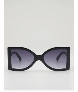 Detail view of large butterfly sunglasses with black frame and purple gradient lenses