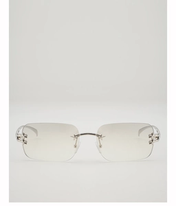 Detailed view of silver star accents on rimless Y2K square sunglasses with gradient lenses