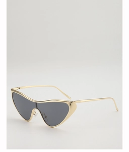 Gros plan sur des lunettes œil-de-chat futuristes avec monture en métal doré