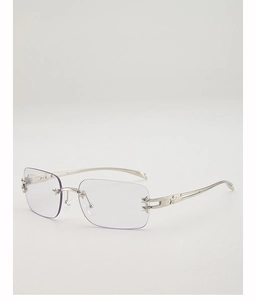 Detail of star-shaped metal engraving on silver temples of rimless Y2K square glasses