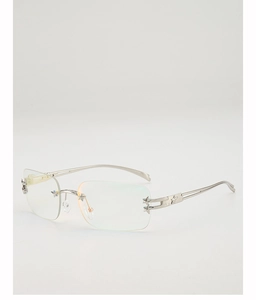 Macro detail of Y2K rimless sunglasses showing silver star accents and hollow temples