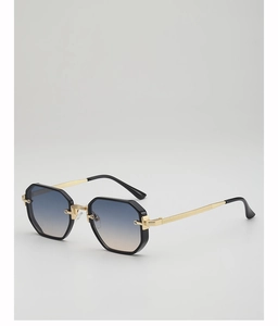 Détail d'une lunette de soleil polygonale vintage avec branches dorées et verres dégradés