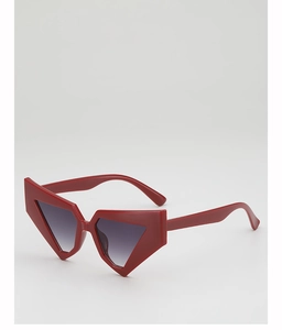 Detailed view of dark red geometric sunglasses with bold angles and grey gradient lenses