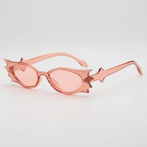 Pink bat-shaped rimless sunglasses with jelly colored lenses for Halloween party wear