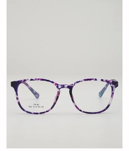 Detailed macro shot of purple floral TR90 optical frames with specs and TR-90 label