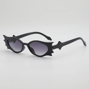 Gothic bat-wing shaped sunglasses with purple gradient lenses and black frames