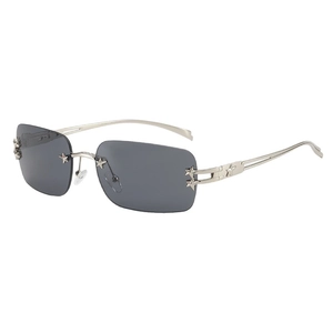 Y2K frameless rectangular gray sunglasses with silver star accents in a 45-degree view
