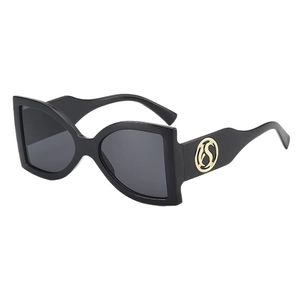 Oversized square sunglasses with black frame and gold metal logo on wide temples