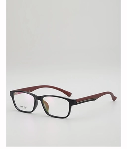 Detail of square glasses with black frame and reddish-brown temples featuring metal accents