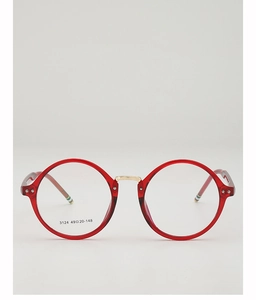 Macro detail of red round frame eyewear with gold bridge and stripe temple tips