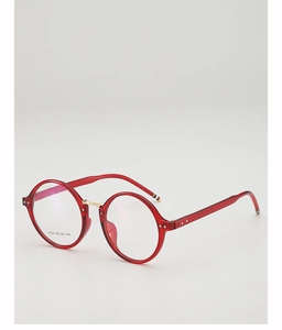 Detail view of red round glasses frames with gold bridge and striped temple tips