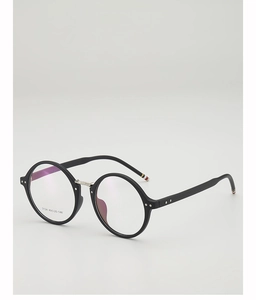Detail view of round black frame glasses with silver bridge and signature tricolor temple tips