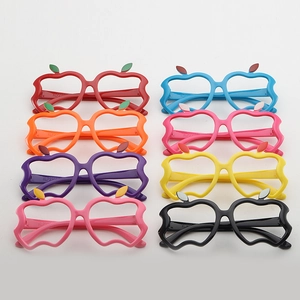 Flat lay of colorful apple-shaped glasses frames for kids in eight different vibrant colors